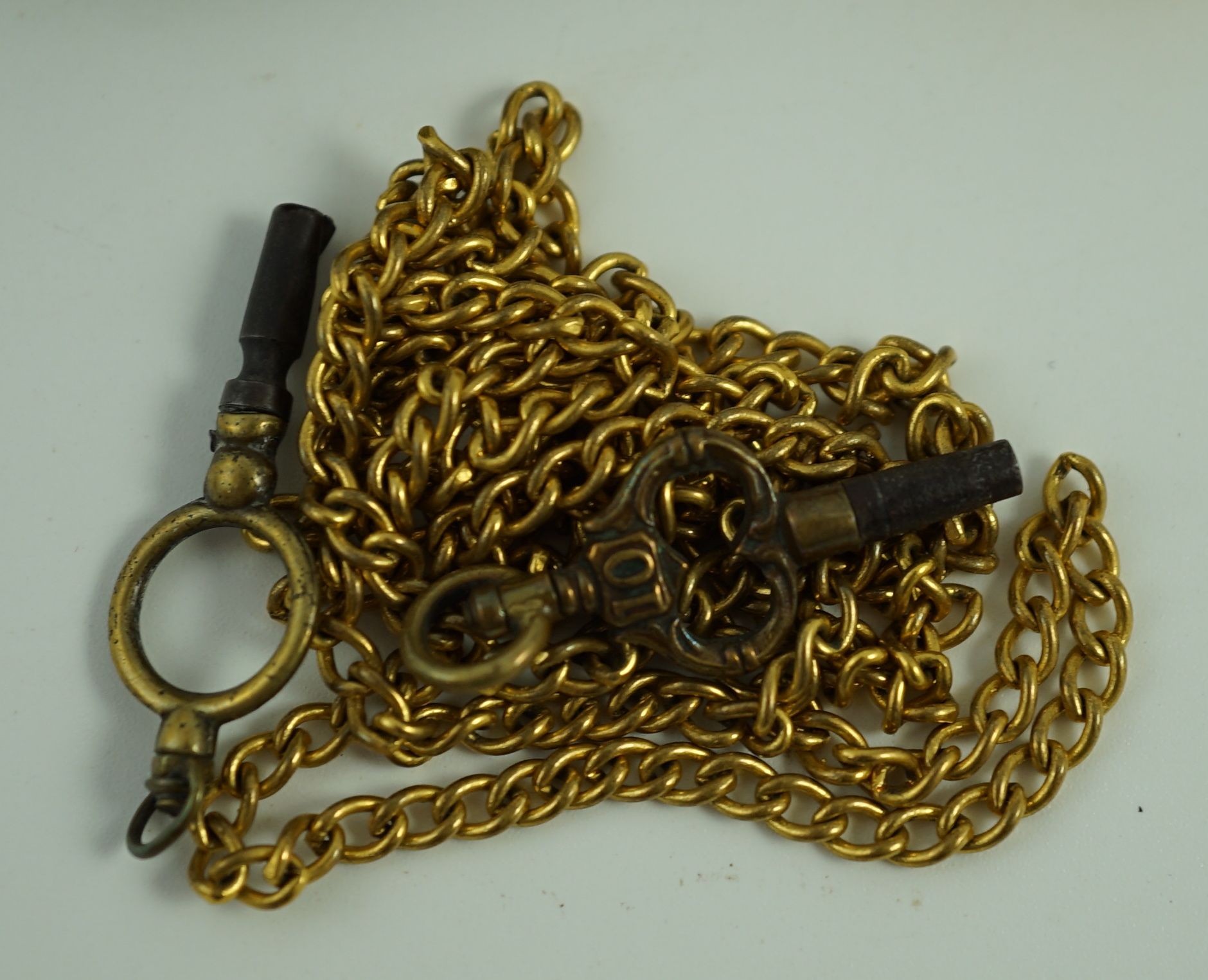A Victorian silver pair cased pocket watch by Edward Fowle, Westerham and a gilt metal pocket watch missing outer case